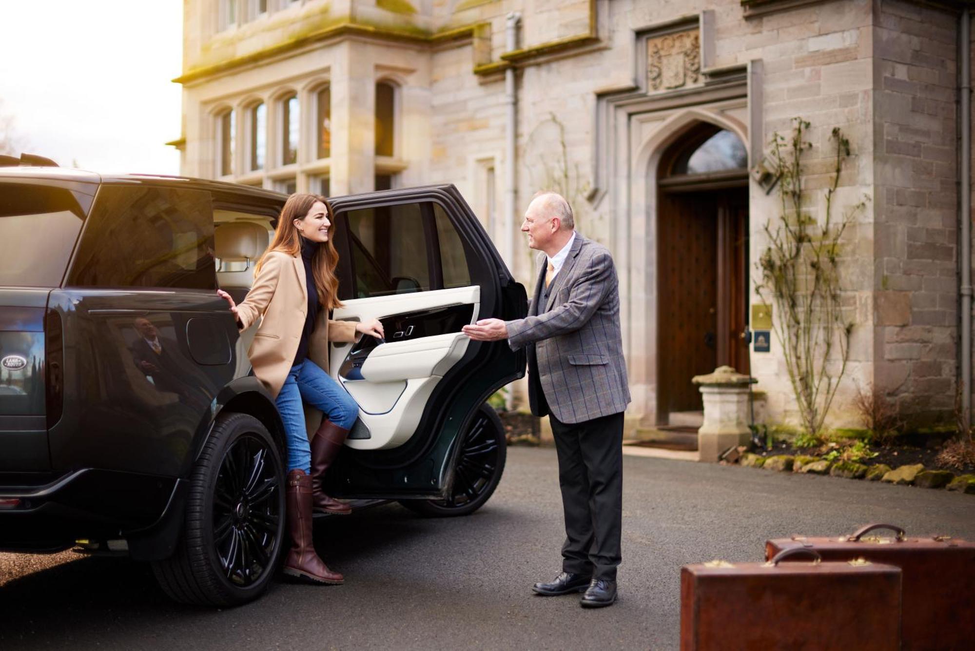 Schloss Roxburghe, Part Of Destination By Hyatt Εξωτερικό φωτογραφία A chauffeur opening the car door for a passenger