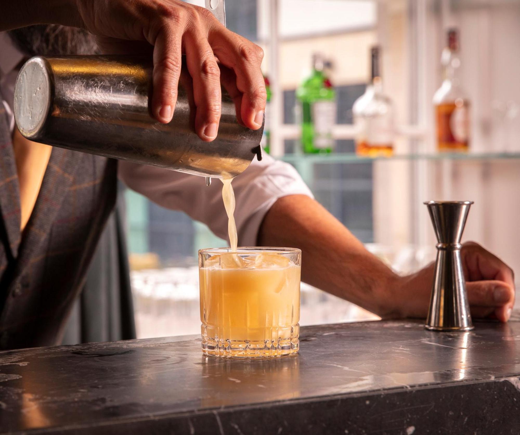 Schloss Roxburghe, Part Of Destination By Hyatt Εξωτερικό φωτογραφία A bartender straining a cocktail