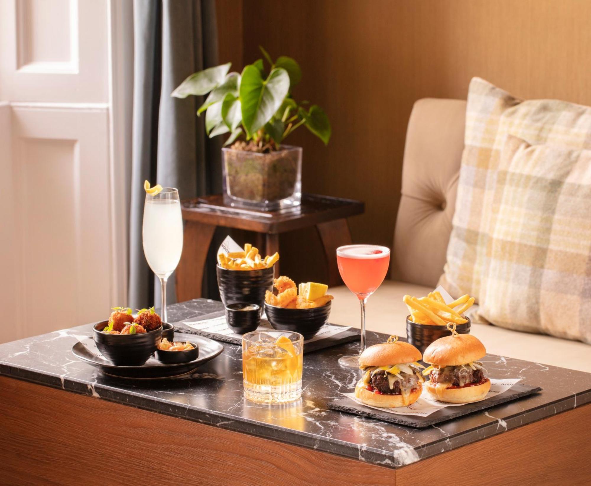 Schloss Roxburghe, Part Of Destination By Hyatt Εξωτερικό φωτογραφία A selection of cocktails and bar snacks at the bar